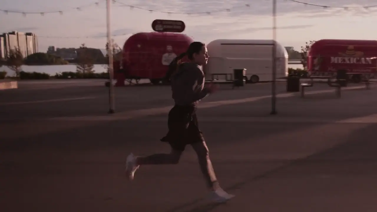 The runner in full stride across the plaza.